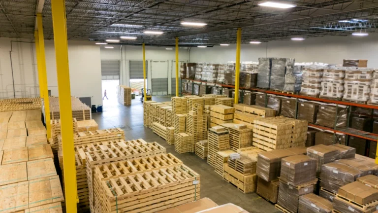 Ceiling view of GPC Texas warehouse filled with wooden pallets and boxes.