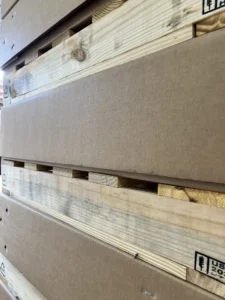 Heavy-duty corrugated shipping containers engineered for industrial shipping, mounted on wooden pallets